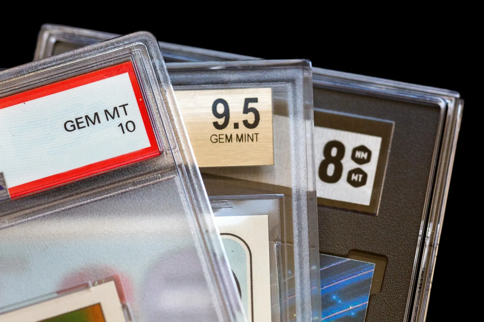 Graded trading cards protected in clear plastic slabs