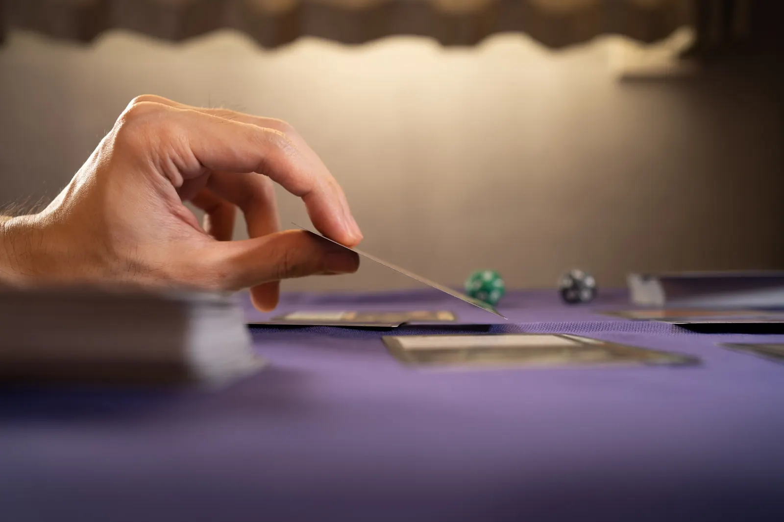 Collector drawing a trading card during a tabletop card game